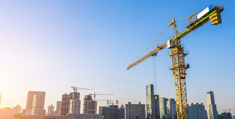 Crane above city skyline