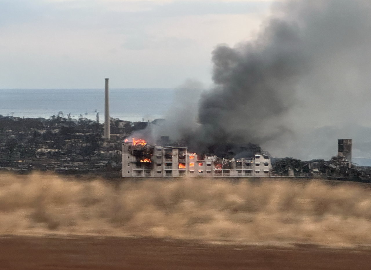  Urban conflagration resulted in the majority of structures being destroyed, including mid-rise multi-family dwellings.  View looking west from Lahaina Bypass. Source: Guy Carpenter